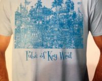 A Key West Sign in Blue Color on a White T Shirt