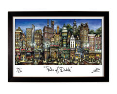 Framed artwork titled "pubs of dublin," featuring a colorful and stylized illustration of various iconic pub facades in dublin.